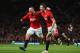 Rooney and Evans Combine for, and then Celebrate the Winning Goal