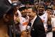 PHOENIX, AZ - MARCH 24: Head coach Rick Pitino celebrates with the Louisville Cardinals before he gets interviewed by Reggie Miller after the Cardinals defeat the Florida Gators 72-68 during the 2012 NCAA Men's Basketball West Regional Final at US Airways Center on March 24, 2012 in Phoenix, Arizona. (Photo by Jamie Squire/Getty Images)
