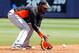 PORT CHARLOTTE, FL - MARCH 25: Shortstop Jose Reyes #7 of the Miami Marlins fields a ground ball against the Tampa Bay Rays during a Grapefruit League Spring Training Game at the Charlotte Sports Complex on March 25, 2012 in Port Charlotte, Florida. (Photo by J. Meric/Getty Images)