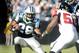 CHARLOTTE, NC - DECEMBER 11: Jonathan Stewart #28 of the Carolina Panthers tries to avoid Curtis Lofton #50 of the Atlanta Falcons at Bank of America Stadium on December 11, 2011 in Charlotte, North Carolina. (Photo by Jared C. Tilton/Getty Images)