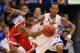Ohio State guard William Buford and Kansas guard Travis Releford scramble for a ball in the teams' first meeting