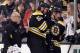 BOSTON, MA - MARCH 29: Adam McQuaid #54 of the Boston Bruins is helped off the ice after getting hit by Jason Chimera #25 of the Washington Capitals on March 29, 2012 at TD Garden in Boston, Massachusetts. (Photo by Elsa/Getty Images)