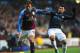 BIRMINGHAM, ENGLAND - FEBRUARY 12: Stiliyan Petrov of Aston Villa is tackled by Sergio Aguero of Man City during the Barclays Premier league match between Aston Villa and Manchester City at Villa Park on February 12, 2012 in Birmingham, England. (Photo by Michael Regan/Getty Images)