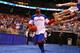 ST LOUIS, MO - MARCH 25: Tyshawn Taylor #10 of the Kansas Jayhawks greets fans as he runs out to the court to play against the North Carolina Tar Heels during the 2012 NCAA Men's Basketball Midwest Regional Final at Edward Jones Dome on March 25, 2012 in St Louis, Missouri. (Photo by Dilip Vishwanat/Getty Images)