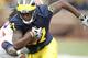 ANN ARBOR, MI - NOVEMBER 06: Junior Hemingway #21 of the Michigan Wolverines runs for a second quarter touchdown after escaping the tackle of Terry Hawthorne #1 of the Illinios Fighting Illini after a second quarter reception at Michigan Stadium on November 6, 2010 in Ann Arbor, Michigan. (Photo by Gregory Shamus/Getty Images)