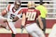 CHESTNUT HILL, MA - SEPTEMBER 25: Tyrod Taylor #5 of the Virginia Tech Hokies scrambles with the ball as Luke Kuechly #40 of the Boston College Eagles defends on September 25, 2010 at Alumni Stadium in Chestnut Hill, Massachusetts. (Photo by Elsa/Getty Images)
