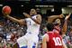 ATLANTA, GA - MARCH 23: Darius Miller #1 of the Kentucky Wildcats shoots past Christian Watford #2 and Will Sheehey #10 of the Indiana Hoosiers in the second half during the 2012 NCAA Men's Basketball South Regional Semifinal game at the Georgia Dome on March 23, 2012 in Atlanta, Georgia. The Kentucky Wildcats defeated the Indiana Hoosiers 102 to 90. (Photo by Kevin C. Cox/Getty Images)
