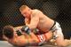 LAS VEGAS - JULY 11: Brock Lesnar holds down Frank Mir during their heavyweight title bout during UFC 100 on July 11, 2009 in Las Vegas, Nevada. Lesnar defeated Mir by a second round knockout. (Photo by Jon Kopaloff/Getty Images)