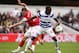 LONDON, ENGLAND - MARCH 31: Aaron Ramsey of Arsenal and Nedum Onuoha of Queens Park Rangers battle for the ball during the Barclays Premier League match between Queens Park Rangers and Arsenal at Loftus Road on March 31, 2012 in London, England. (Photo by Ian Walton/Getty Images)