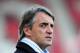 STOKE ON TRENT, ENGLAND - MARCH 24: Roberto Mancini the manager of Manchester City looks
on prior to kickoff during the Barclays Premier League match between Stoke City and Manchester City at the Britannia Stadium on March 24, 2012 in Stoke on Trent, England. (Photo by Shaun Botterill/Getty Images)