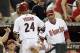 PHOENIX, AZ - OCTOBER 04: Chris Young #24 of the Arizona Diamondbacks is greeted at the dugout by manager Kirk Gibson after Young scores in the fifth inning on a single by Ryan Roberts #14 against the Milwaukee Brewers in Game Three of the National League Division Series at Chase Field on October 4, 2011 in Phoenix, Arizona. (Photo by Christian Petersen/Getty Images)