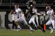 STARKVILLE, MS - NOVEMBER 12: quarterback AJ McCarron #10 of the Alabama Crimson Tide scrambles away from pressure from defensive lineman Fletcher Cox #94 of the Mississippi State Bulldogs on November 12, 2011 at Davis Wade Stadium in Starkville, Mississippi. Alabama won 24-7. (Photo by Butch Dill/Getty Images)