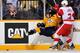 NASHVILLE, TN - MARCH 10: Brendan Smith #2 of the Detroit Red Wings checks Jordin Tootoo #22 of the Nashville Predators at Bridgestone Arena on March 10, 2012 in Nashville, Tennessee. (Photo by Frederick Breedon/Getty Images)