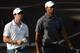 ABU DHABI, UNITED ARAB EMIRATES - JANUARY 28: Rory McIlroy of Northern Ireland and Tiger Woods of the USA during the third round of Abu Dhabi HSBC Golf Championship at the Abu Dhabi HSBC Golf Championship on January 28, 2012 in Abu Dhabi, United Arab Emirates. (Photo by Ross Kinnaird/Getty Images)