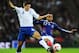 M'Vila battling with English midfielder Steven Gerrard