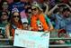 MIAMI GARDENS, FL - JANUARY 01: Fans of Defensive end Jason Taylor #99 of the Miami Dolphins hold a sign against the New York Jets at Sun Life Stadium on January 1, 2012 in Miami Gardens, Florida. (Photo by Marc Serota/Getty Images)