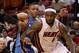 MIAMI, FL - MARCH 16: LeBron James #6 of the Miami Heat drives by Russell Westbrook #0 of the Oklahoma City Thunder during a game at American Airlines Arena on March 16, 2011 in Miami, Florida. NOTE TO USER: User expressly acknowledges and agrees that, by downloading and/or using this Photograph, User is consenting to the terms and conditions of the Getty Images License Agreement. (Photo by Mike Ehrmann/Getty Images)