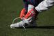 DENVER, CO - JANUARY 01: A member of the DENVER BRONCOS ties his shoe during warm ups prior to facing the Kansas City Chiefs at Sports Authority Field at Mile High on January 1, 2012 in Denver, Colorado. (Photo by Doug Pensinger/Getty Images)