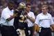 NEW ORLEANS, LA - OCTOBER 6: The training staff attends to safety Steve Gleason #37 of the New Orleans Saints during the NFL game against the Pittsburgh Steelers on October 6, 2002 at the Louisiana Superdome in New Orleans, Louisiana. The Saints won 32-29. (Photo by Matthew Stockman/Getty Images)