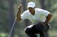 AUGUSTA, GA - APRIL 07: Tiger Woods of the United States lines up a putt on the third green during the third round of the 2012 Masters Tournament at Augusta National Golf Club on April 7, 2012 in Augusta, Georgia. (Photo by Jamie Squire/Getty Images)