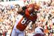 CINCINNATI, OH - DECEMBER 24: Jerome Simpson #89 of the Cincinnati Bengals jumps over Daryl Washington #58 of the Arizona Cardinals for a 19-yard touchdown during first half action at Paul Brown Stadium on December 24, 2011 in Cincinnati, Ohio. (Photo by Joe Robbins/Getty Images)