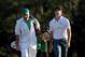 AUGUSTA, GA - APRIL 07: Rory McIlroy (R) of Northern Ireland reacts as he walks up the 18th fairway with his caddie J.P. Fitzgerald during the third round of the 2012 Masters Tournament at Augusta National Golf Club on April 7, 2012 in Augusta, Georgia. (Photo by Jamie Squire/Getty Images)