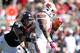 CINCINNATI, OH - OCTOBER 15: Derek Wolfe #95 of the Cincinnati Bearcats tackles Dominique Brown #10 of the Louisville Cardinals during the game at Paul Brown Stadium on October 15, 2011 in Cincinnati, Ohio. (Photo by Andy Lyons/Getty Images)