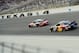 FORT WORTH, TX - NOVEMBER 06: Tony Stewart, driver of the #14 Office Depot/Mobil 1 Chevrolet, leads Kasey Kahne, driver of the #4 Red Bull Toyota, during the NASCAR Sprint Cup Series AAA Texas 500 at Texas Motor Speedway on November 6, 2011 in Fort Worth, Texas. (Photo by John Harrelson/Getty Images for NASCAR)