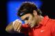 MELBOURNE, AUSTRALIA - JANUARY 26: Roger Federer of Switzerland wipes his face n in his semifinal match against Rafael Nadal of Spain during day eleven of the 2012 Australian Open at Melbourne Park on January 26, 2012 in Melbourne, Australia. (Photo by Cameron Spencer/Getty Images)