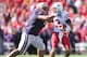 SEATTLE - SEPTEMBER 18: Quarterback Taylor Martinez #3 of the Nebraska Cornhuskers is tackled by Alameda Ta'amu #74 of the Washington Huskies on September 18, 2010 at Husky Stadium in Seattle, Washington. (Photo by Otto Greule Jr/Getty Images)