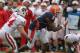 CHAMPAIGN, IL - NOVEMBER 19: Jon Davis #3 of the Illinois Fighting Illini moves with the ball as Chris Borland #44 of the Wisconsin Badgers closes in at Memorial Stadium on November 19, 2011 in Champaign, Illinois. Wisconsin defeated Illinois 28-17. (Photo by Jonathan Daniel/Getty Images)
