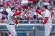 CINCINNATI, OH - APRIL 9: David Freese #23 of the St. Louis Cardinals celebrates with teammate Lance Berkman #12 after hitting a two-run home run in the first inning against the Cincinnati Reds at Great American Ball Park on April 9, 2012 in Cincinnati, Ohio. (Photo by Joe Robbins/Getty Images)