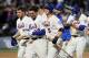 David Wright and the Mets celebrate Daniel Murphy's walk-off hit to defeat the Washington Nationals Monday night.