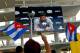 MIAMI, FL - APRIL 10: Protesters rally outside as Miami Marlins Manager Ozzie Guillen seen on a screen speaks during a press conference about comments made about Fidel Castro at Marlins Park on April 10, 2012 in Miami, Florida. The Marlins suspended Guillen for five games over his pro-Castro comments. (Photo by Mike Ehrmann/Getty Images)