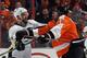 PHILADELPHIA, PA - FEBRUARY 18: Deryk Engelland #5 of the Pittsburgh Penguins hits Scott Hartnell #19 of the Philadelphia Flyers at the Wells Fargo Center on February 18, 2012 in Philadelphia, Pennsylvania. (Photo by Bruce Bennett/Getty Images)