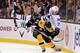 Brad Marchand throwing a low bridge hit on Daniel Sedin