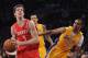 LOS ANGELES, CA - APRIL 06: Goran Dragic #3 of the Houston Rockets heads to the basket past Ramon Sessions #7 of the Los Angeles Lakers during a 112-107 Rockets win at Staples Center on April 6, 2012 in Los Angeles, California. NOTE TO USER: User expressly acknowledges and agrees that, by downloading and or using this photograph, User is consenting to the terms and conditions of the Getty Images License Agreement. (Photo by Harry How/Getty Images)