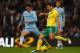 MANCHESTER, ENGLAND - DECEMBER 03: Russell Martin of Norwich City attempts to clear the ball from David Silva of Manchester City during the Barclays Premier League match between Manchester City and Norwich City at Etihad Stadium on December 3, 2011 in Manchester, England. (Photo by Clive Brunskill/Getty Images)