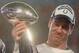 MIAMI GARDENS, FL - FEBRUARY 04: Quarterback Peyton Manning #18 of the Indianapolis Colts smiles as he holds the Vince Lombardi Super Bowl trophy after his team won the Super Bowl XLI 29-17 over the Chicago Bears on February 4, 2007 at Dolphin Stadium in Miami Gardens, Florida. (Photo by Donald Miralle/Getty Images)