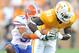 KNOXVILLE, TN - SEPTEMBER 18: Brian Biada #31 of the Florida Gators tackles Da'Rick Rogers #21 of the Tennessee Volunteers at Neyland Stadium on September 18, 2010 in Knoxville, Tennessee. Florida won 31-17. (Photo by Grant Halverson/Getty Images)