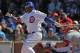 CHICAGO, IL - APRIL 05: Marlon Byrd #24 of the Chicago Cubs hits a run-scoring single in the 4th inning against the Washington Nationals during the opening day game at Wrigley Field on April 5, 2012 in Chicago, Illinois. (Photo by Jonathan Daniel/Getty Images)