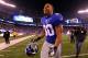 EAST RUTHERFORD, NJ - JANUARY 01: Victor Cruz #80 of the New York Giants celebrates as he runs off of the field after defeating the Dallas Cowboys at MetLife Stadium on January 1, 2012 in East Rutherford, New Jersey. (Photo by Al Bello/Getty Images)
