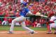 ST. LOUIS, MO - APRIL 13: Starlin Castro #13 of the Chicago Cubs hits an RBI single against the Chicago Cubs during the home-opening game at Busch Stadium on April 13, 2012 in St. Louis, Missouri. (Photo by Dilip Vishwanat/Getty Images)
