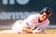 BOSTON, MA - APRIL 13: Jacoby Ellsbury #2 of the Boston Red Sox reacts after he was injured in a double play in the bottom of the fourth inning against the Tampa Bay Rays during the home opener on April 13, 2012 at Fenway Park in Boston, Massachusetts. (Photo by Elsa/Getty Images)