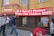 Red Sox fans streaming out of Fenway catch this sign outside Popeyes.