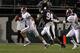 STARKVILLE, MS - NOVEMBER 12: quarterback AJ McCarron #10 of the Alabama Crimson Tide scrambles away from pressure from defensive lineman Fletcher Cox #94 of the Mississippi State Bulldogs on November 12, 2011 at Davis Wade Stadium in Starkville, Mississippi. Alabama won 24-7. (Photo by Butch Dill/Getty Images)