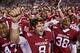 FAYETTEVILLE, AR - NOVEMBER 12: Quarterback Tyler Wilson #8 of the Arkansas Razorbacks sings the fight song with his teammates after a win against the Tennessee Volunteers at Donald W. Reynolds Stadium Stadium on November 12, 2011 in Fayetteville, Arkansas. The Razorbacks defeated the Volunteers 49 to 7. (Photo by Wesley Hitt/Getty Images)