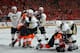 PHILADELPHIA, PA - APRIL 15: The Pittsburgh Penguins and the Philadelphia Flyers battle during the first period in Game Three of the Eastern Conference Quarterfinals during the 2012 NHL Stanley Cup Playoffs at Wells Fargo Center on April 15, 2012 in Philadelphia, Pennsylvania. (Photo by Bruce Bennett/Getty Images)