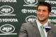 FLORHAM PARK, NJ - MARCH 26: Quarterback Tim Tebow addresses the media as he is introduced as a New York Jet at the Atlantic Health Jets Training Center on March 26, 2012 in Florham Park, New Jersey. Tebow, traded from the Denver Broncos last week, will be the team's backup quarterback according to Jets head coach Rex Ryan. Tebow, the 2007 Heisman Trophy winner, started 11 games in 2011 for Denver and finished with a 7-4 record as a starter. He led the Broncos to a playoff overtime win against the Pittsburgh Steelers in the first round before eventually losing to the New England Patriots in the next round. (Photo by Mike Stobe/Getty Images)
