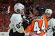Sidney Crosby starts a fight with Kimmo Timonen, but Kris Letang (#58) has to finish it.